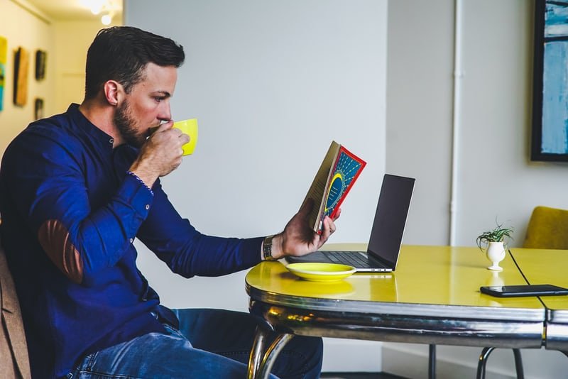 man reads in a coffe