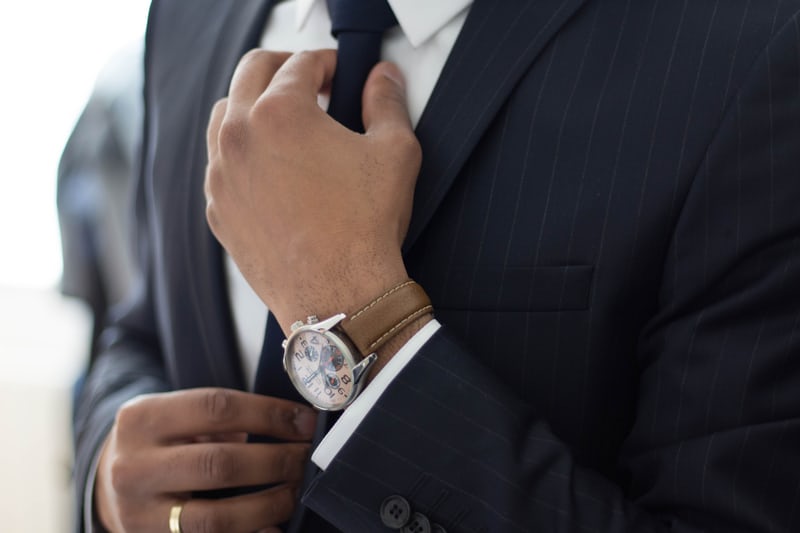 Men in suit wearing a watch