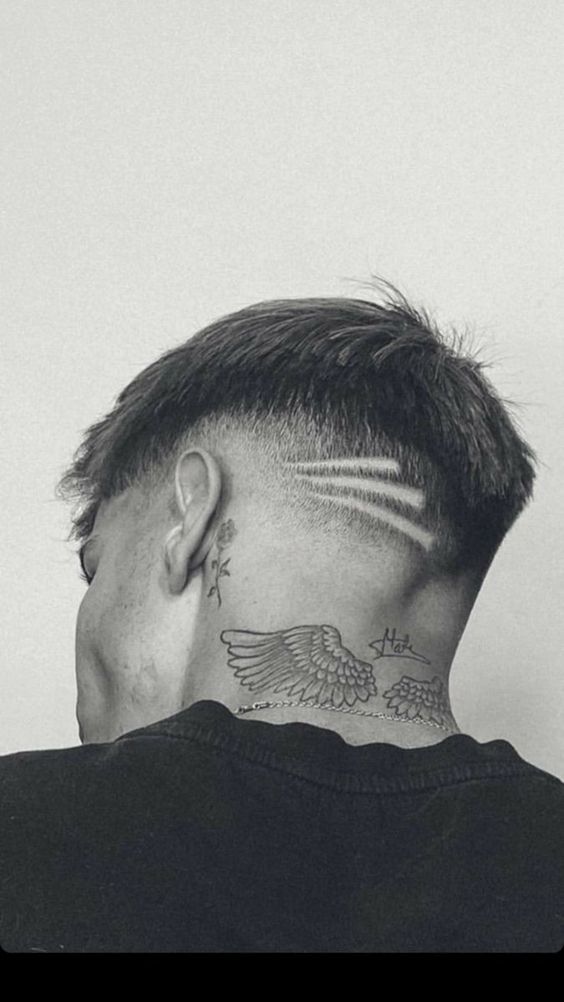 wings neck tattoo